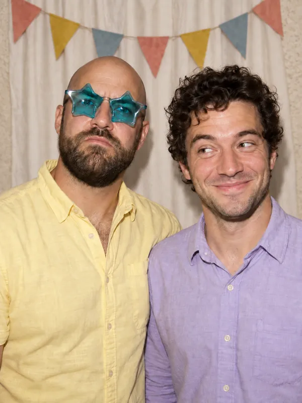 Friends in star glasses at an LA party photobooth
