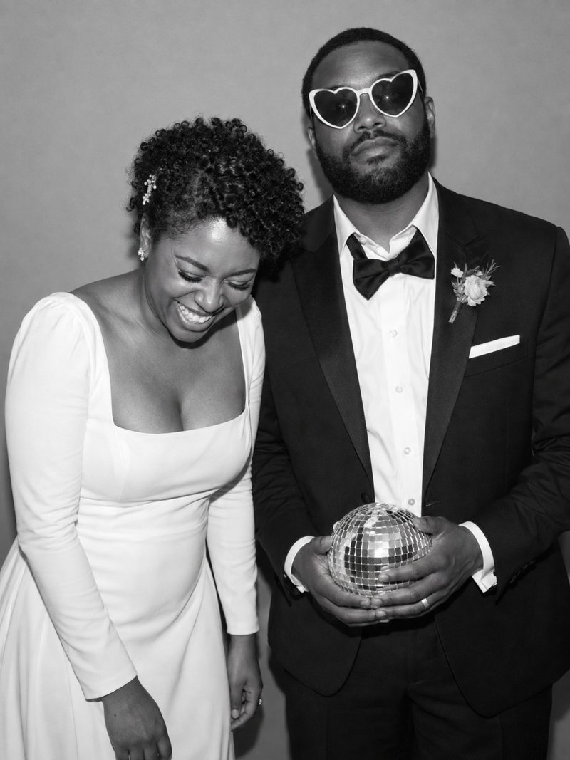 Luxury wedding photobooth LA - newlyweds with a disco ball
